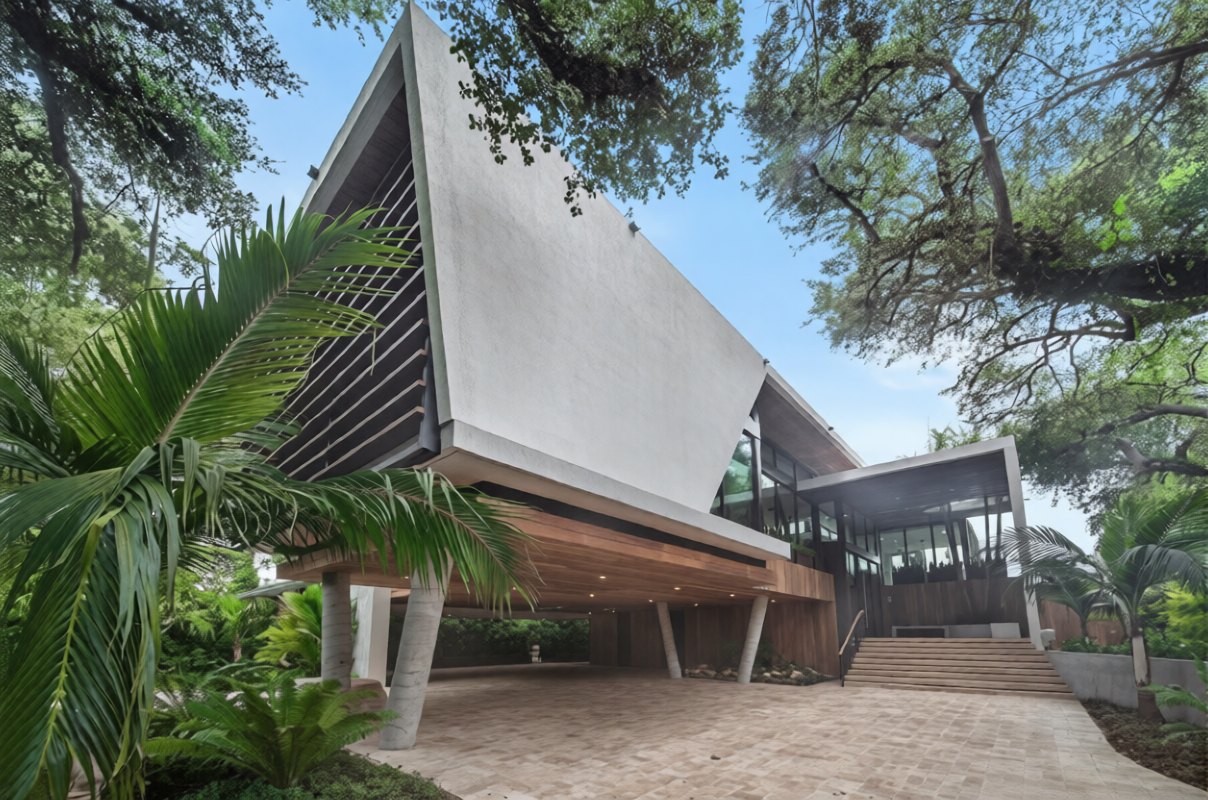 Angled roof and glazed upper level set among live oaks