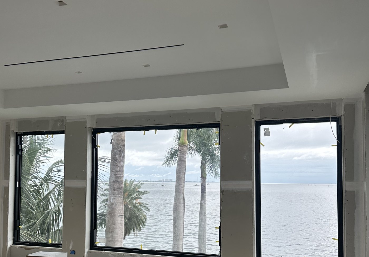 New impact windows looking out over Biscayne Bay at the Devon Court remodel