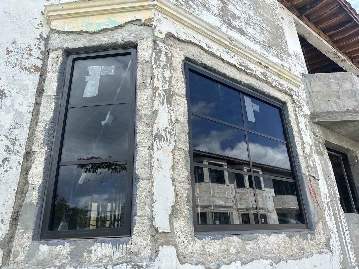 Divided-lite windows in the restored bay, exterior