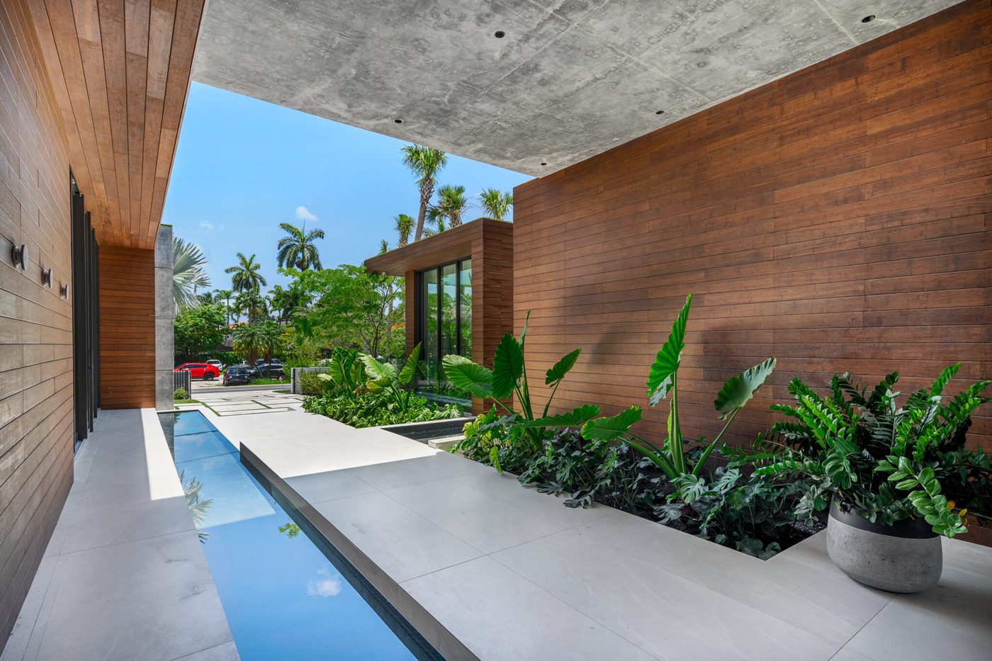 Reflecting pool along the entry with glazing beyond
