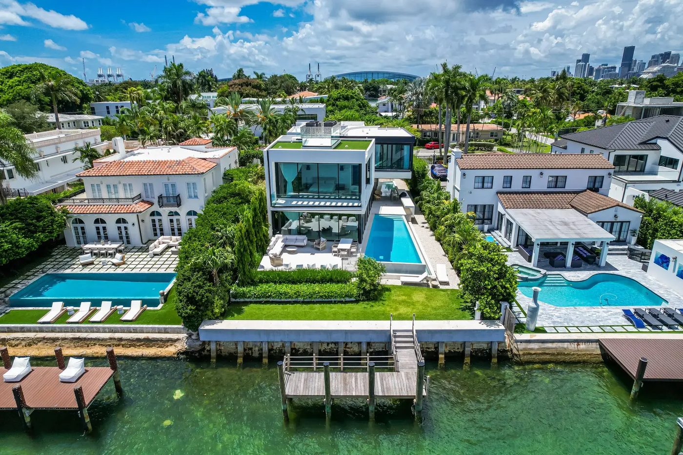 Aerial view of the Hibiscus Island spec home on the bay between its neighbors