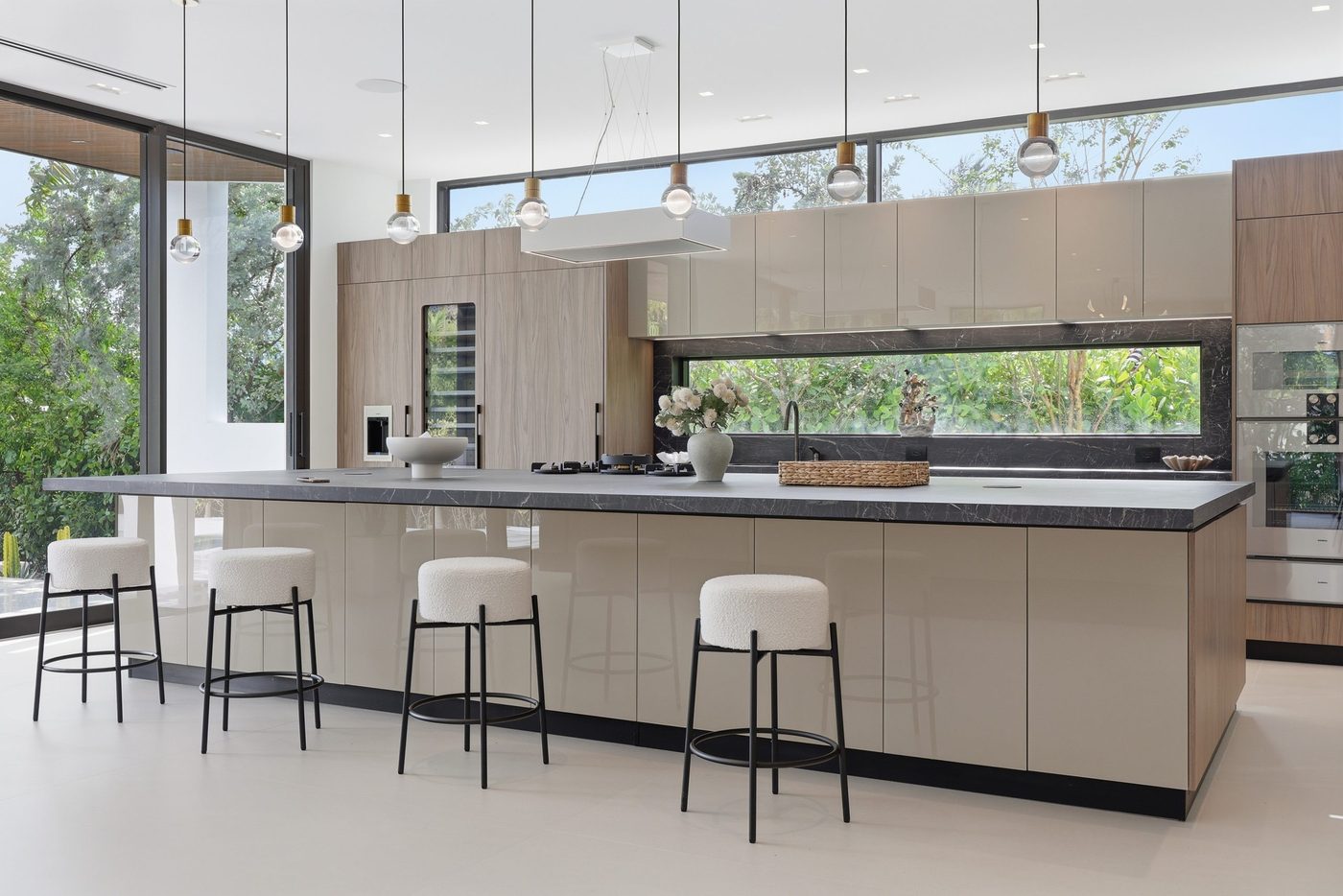 Kitchen with ribbon clerestory windows and sliding glass doors