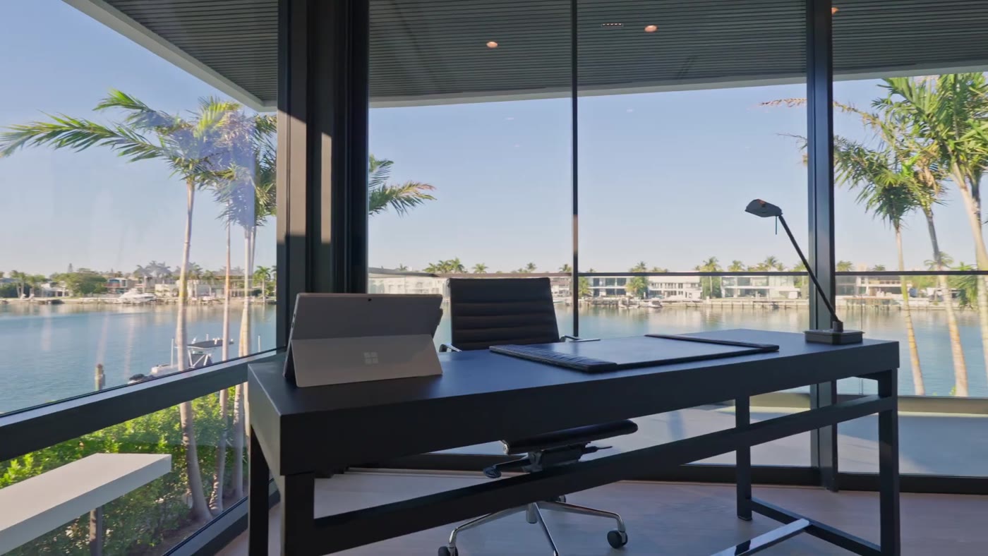Corner office wrapped in glass above the bay