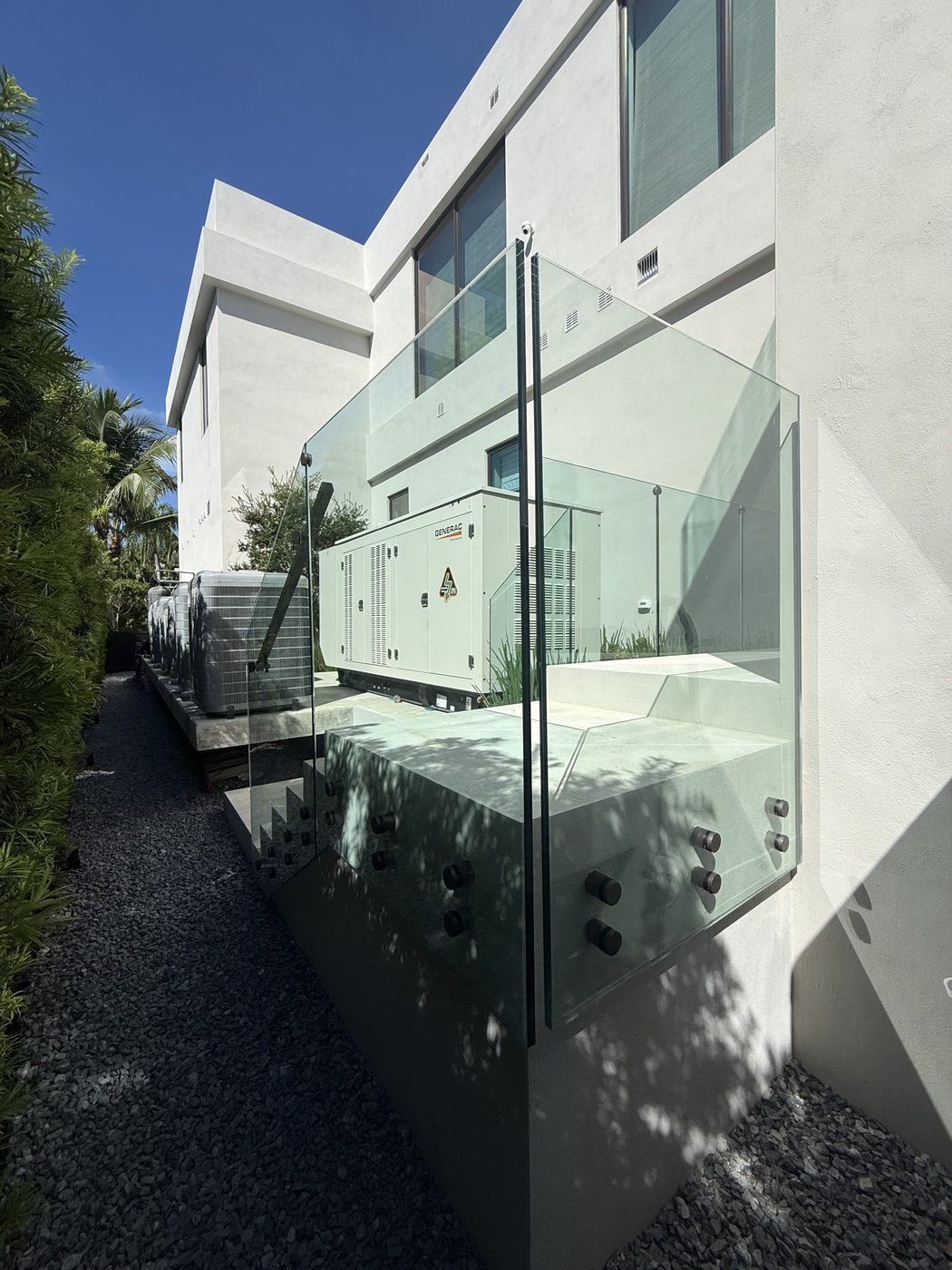 Standoff-mounted frameless glass along an exterior stair